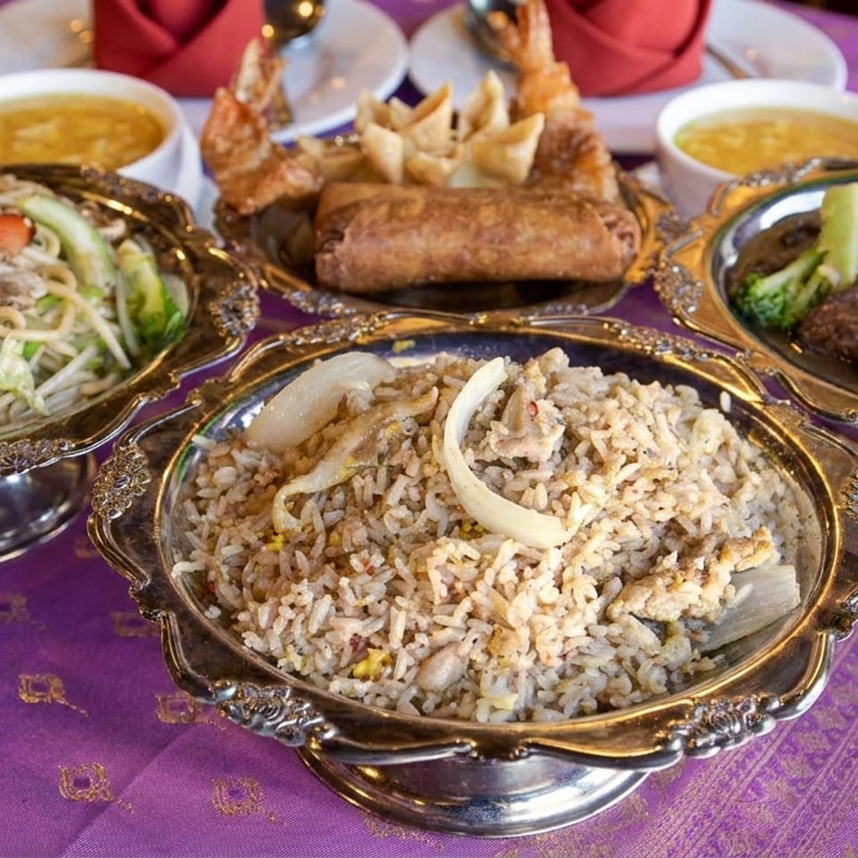 A vibrant spread of Asian dishes, including noodles, fried rice, beef and broccoli, and appetizers.